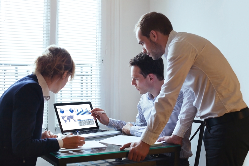Teammates considering data strategy and compliance