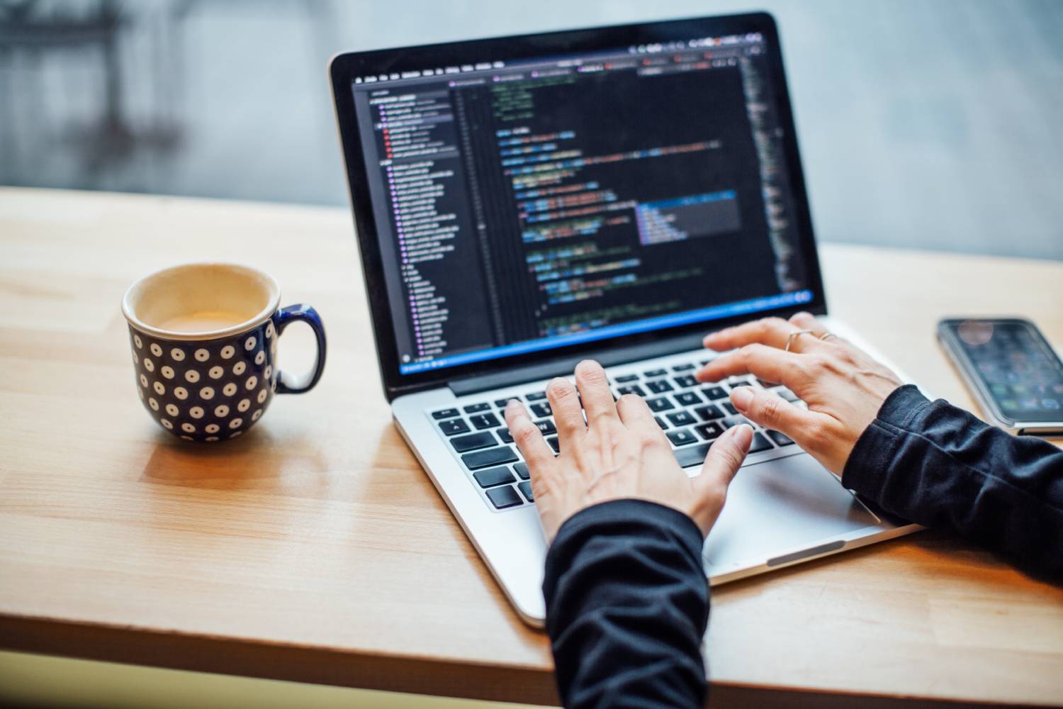 Woman applying data management techniques on her laptop